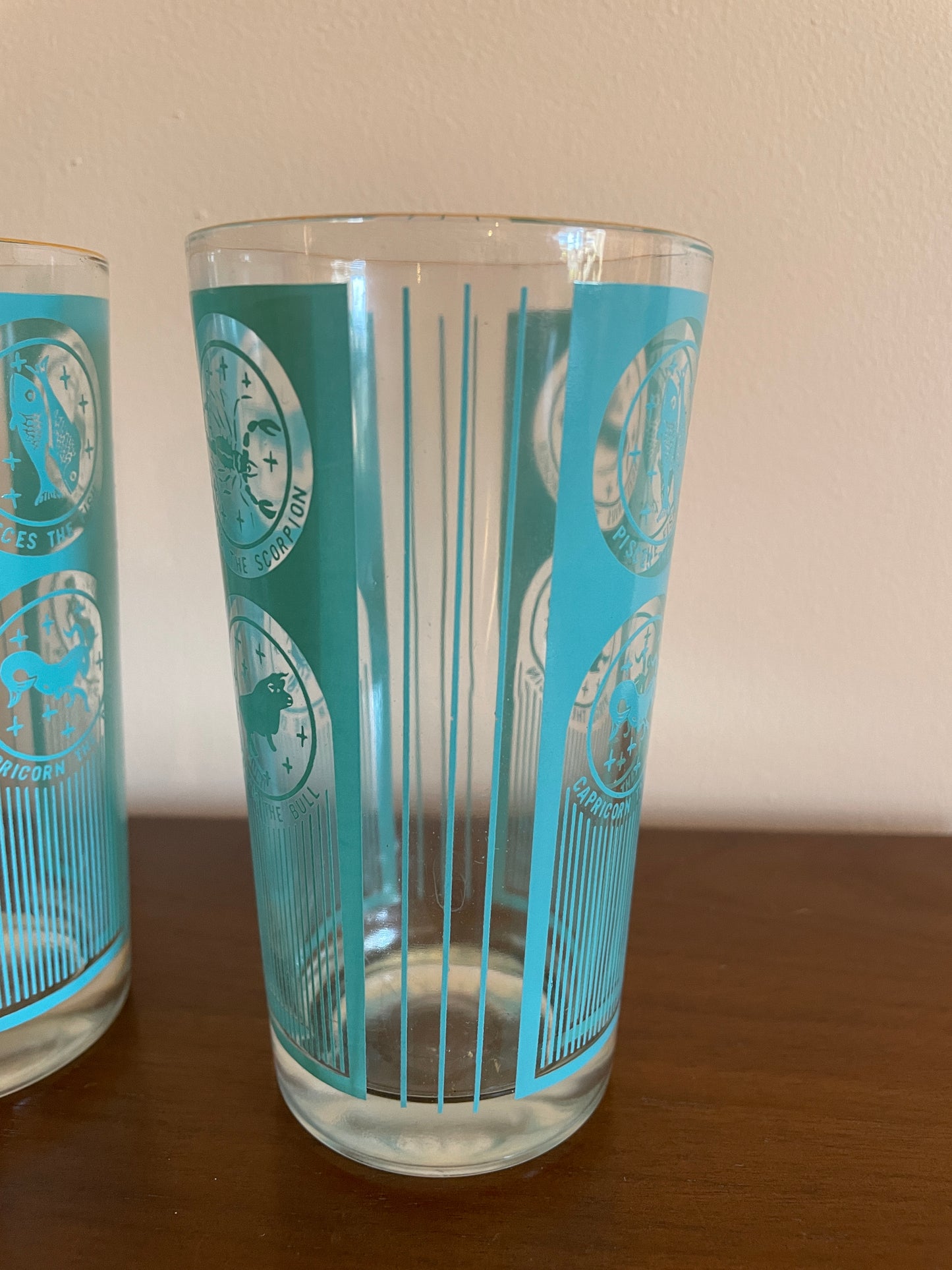 Pair of Gold Rimmed Zodiac Glasses