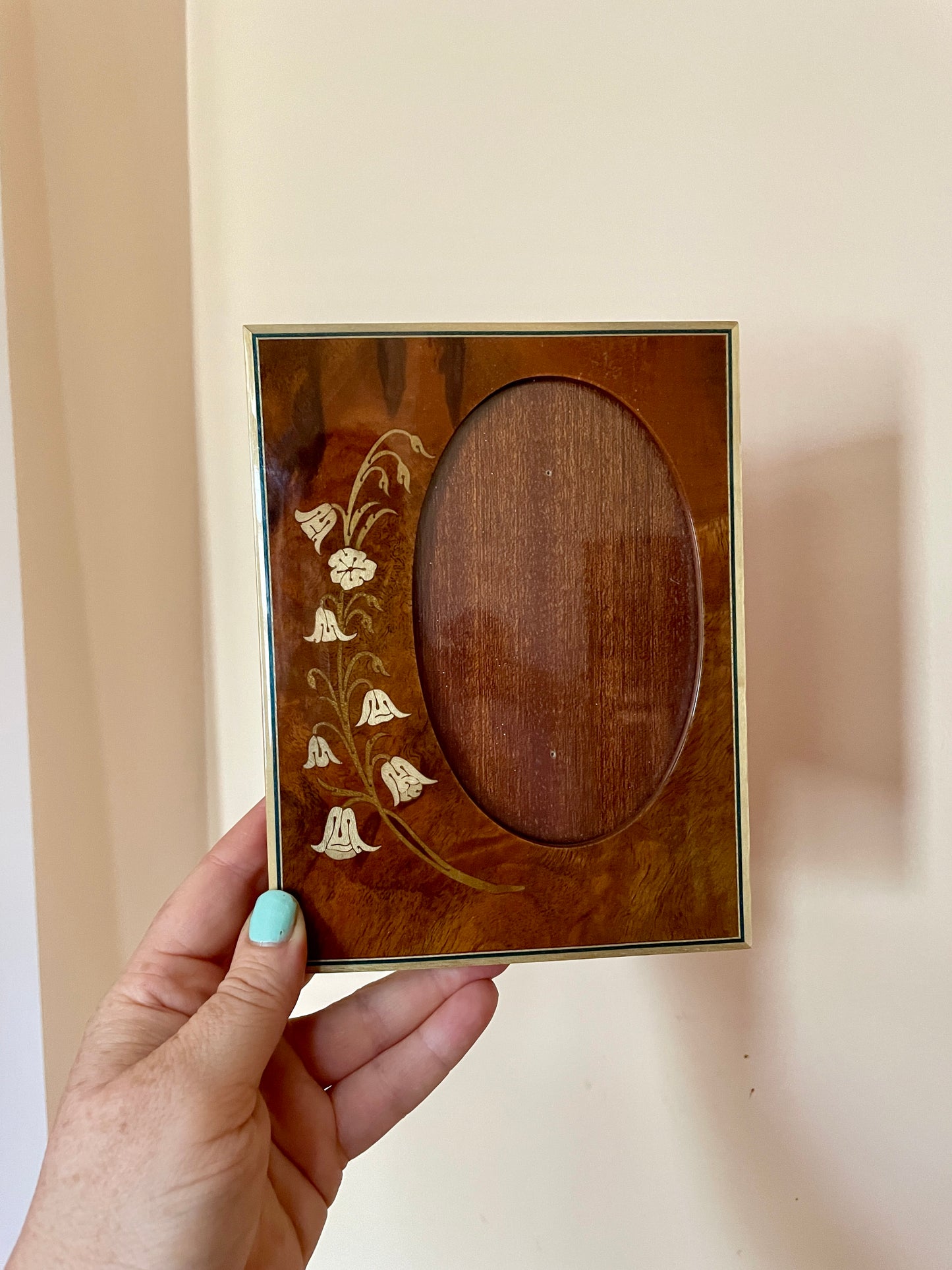 Oval Cutout Frame with Inlaid Wood Floral Detail