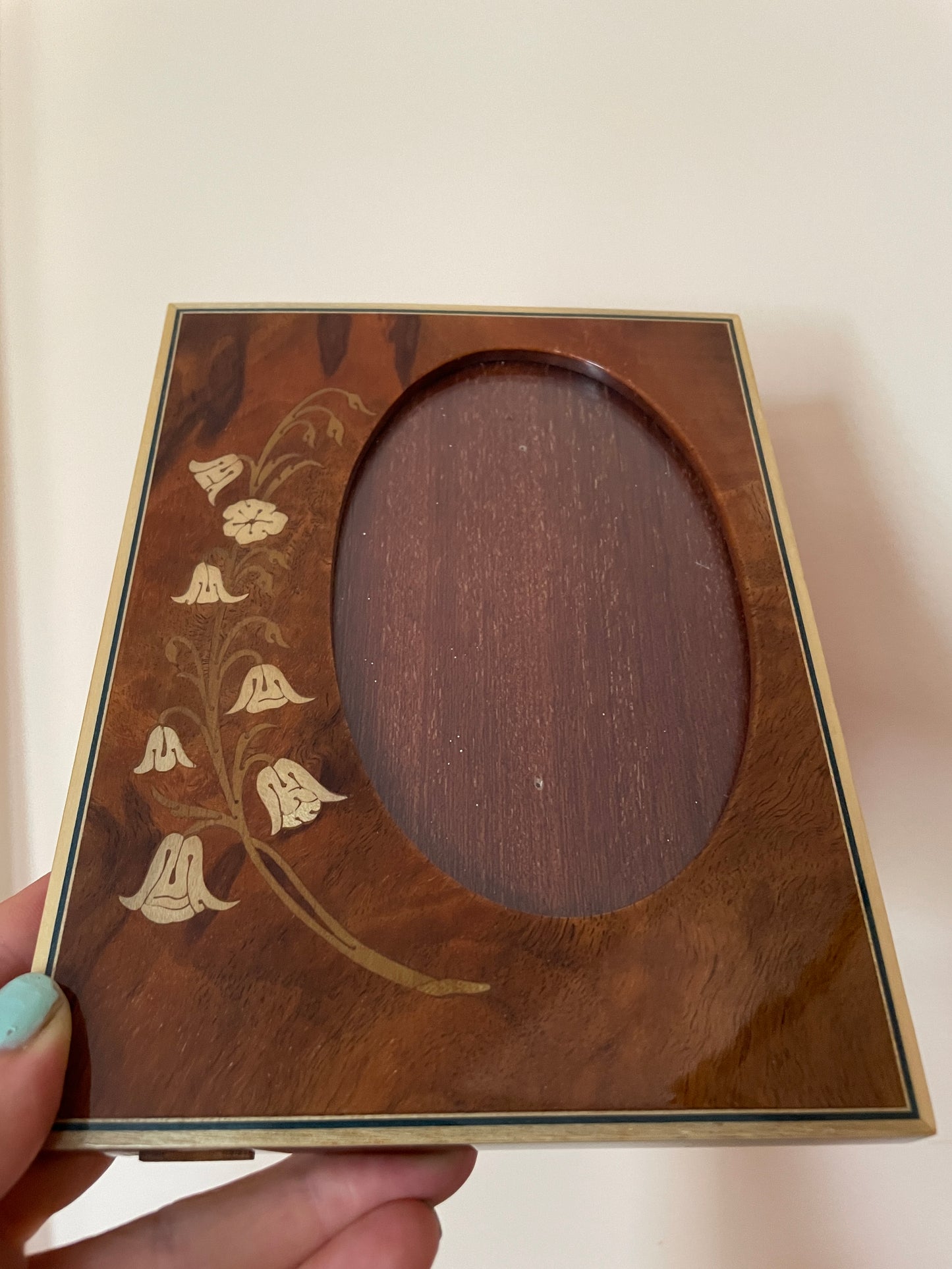 Oval Cutout Frame with Inlaid Wood Floral Detail